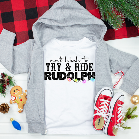 Most Likely to Try And Ride Rudolph Christmas Kids Graphic Tee