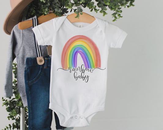 Rainbow Baby Cursive Pregnancy Announcement Onesie®