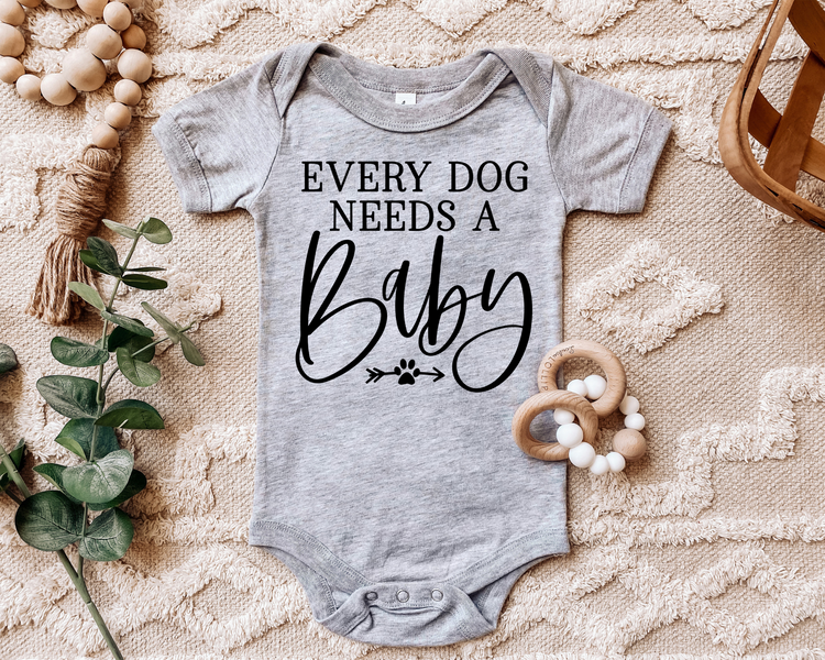 Every Dog Needs A Baby Onesie®